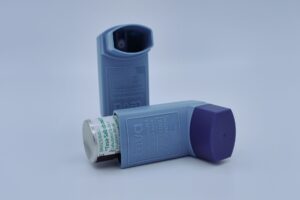 Photo of a blue asthma inhaler