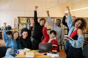 Student celebrating in a library