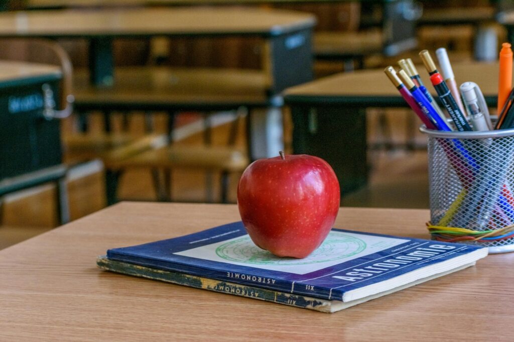 Apple on teachers desk